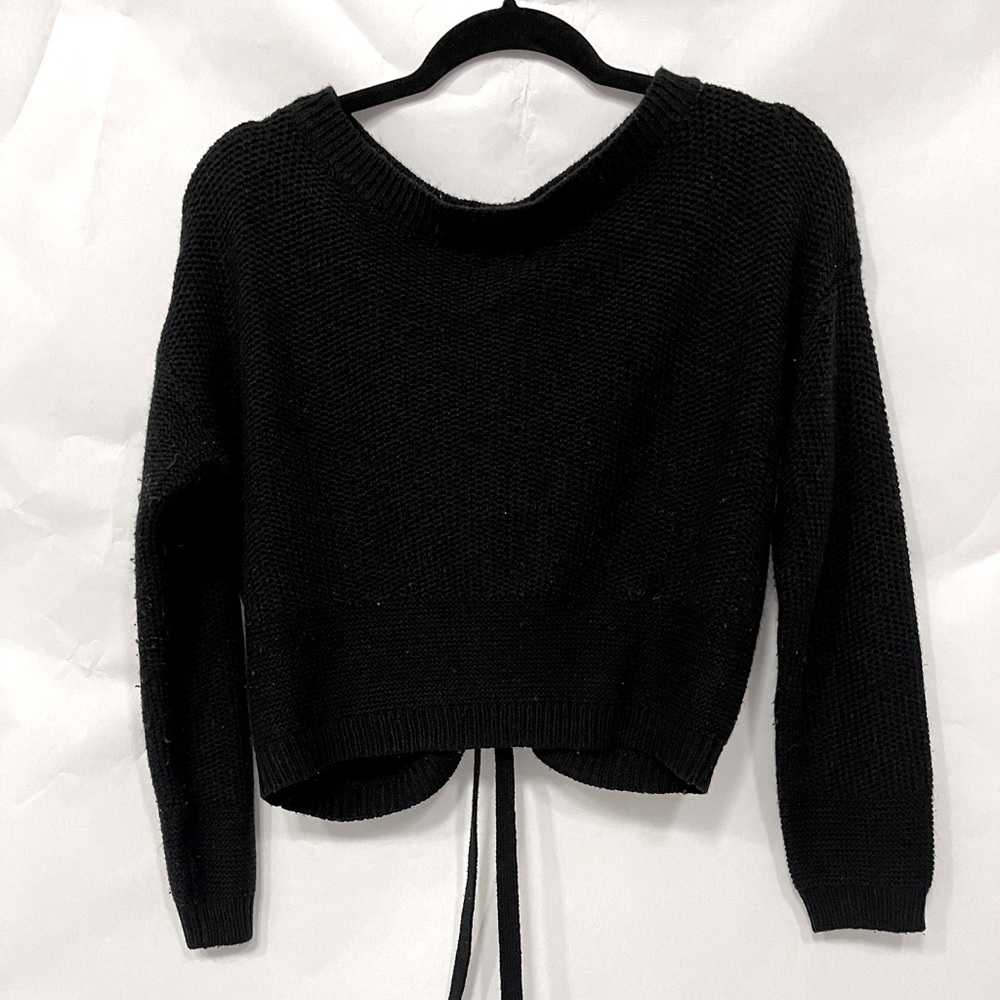 Black sweater with detail on the back size small